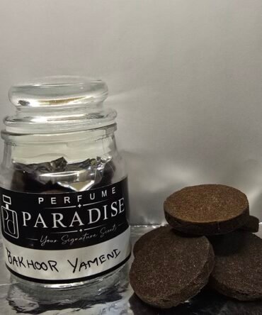 Bakhoor Yamani incense pieces beside a labelled glass jar